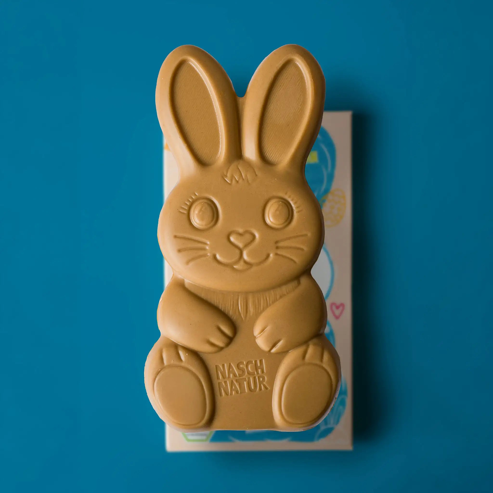 NaschHase Mandel-Kokos Schokolade. Ohne Zuckerzusatz, mit Datteln gesüßt. Der Osterhase von NaschNatur.